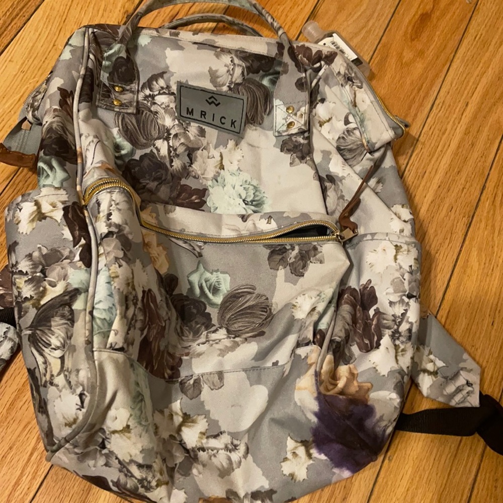 Mrick backbag . Looks nee , but has an ink stain